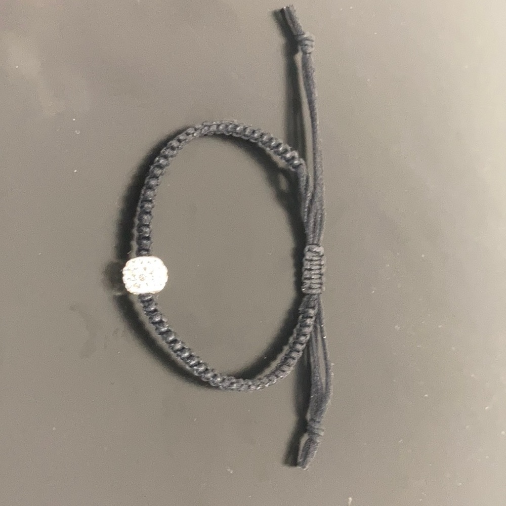 Black leather cobra stitch bracelet w jewel bead.